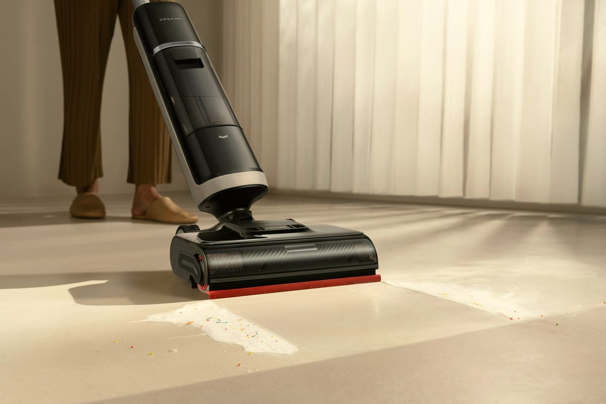 Cordless vacuum removing fine dust from a floor after renovation