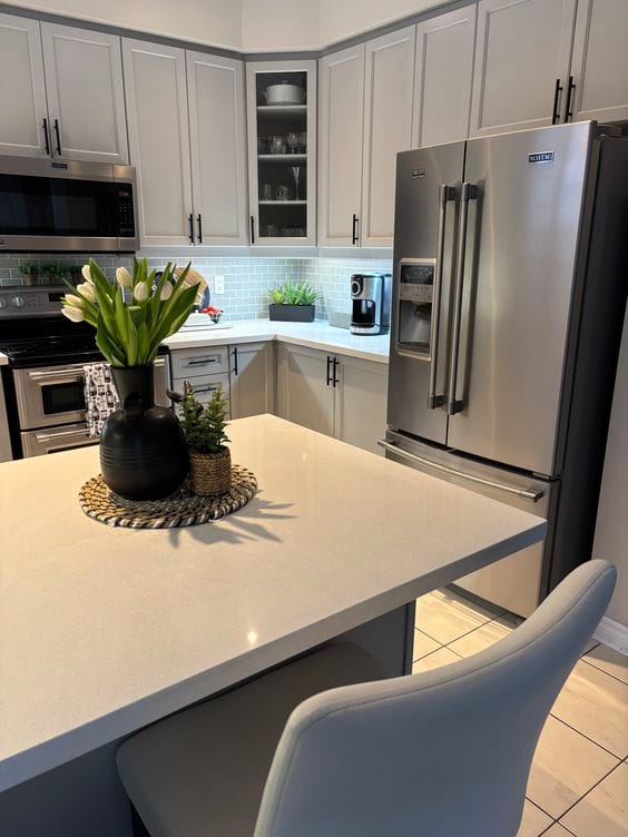 Kitchen island and stainless fridge after a deep clean by VIP Cleaning Squad in St. Catharines