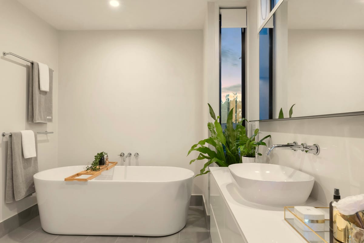 Freshly cleaned bathroom with white bathtub in a Niagara home